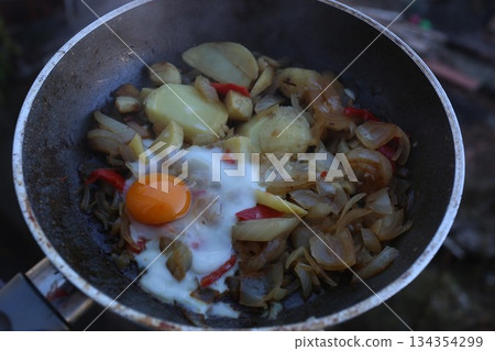 Fried onions, potatoes,bell pepper and eggs - healthy breakfast Fried onions, potatoes,bell pepper and eggs - healthy breakfast 134354299