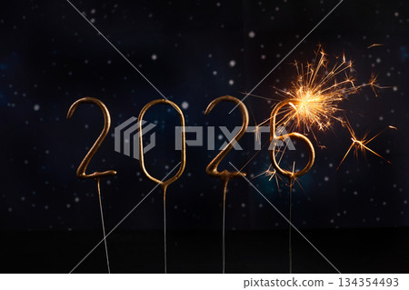 Sparkling New Year 2026. Glowing sparklers forming the number 2026 against a starry night sky 134354493