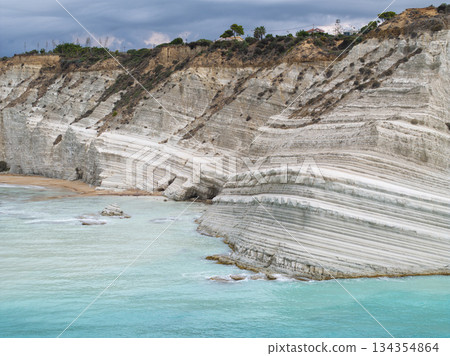 Scala dei Turchi, or the Turkish stairs in Sicily, Italy. Aerial Drone Shot. Unique White Rocks and Turquoise water. Scala dei Turchi, or the Turkish stairs in Sicily, Italy. Aerial Drone Shot. Unique White Rocks and Turquoise water. 134354864