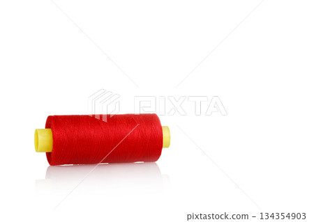 skein of thread red colors macro on a white background 134354903
