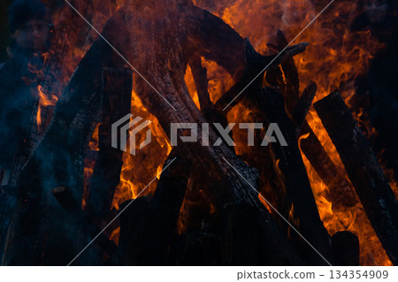 Beautiful fire flames on a campfire Beautiful fire flames on a campfire 134354909