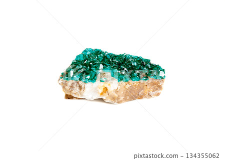 Macro mineral stone Dioptase silicate copper on a white background Macro mineral stone Dioptase silicate copper on a white background 134355062