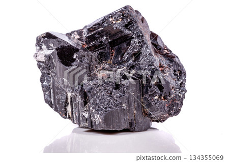 macro mineral stone sherle, schorl, black tourmaline on white background macro mineral stone sherle, schorl, black tourmaline on white background 134355069