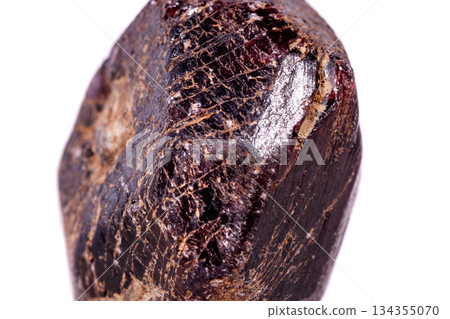 Macro of a mineral garnet stone on a white background Macro of a mineral garnet stone on a white background 134355070