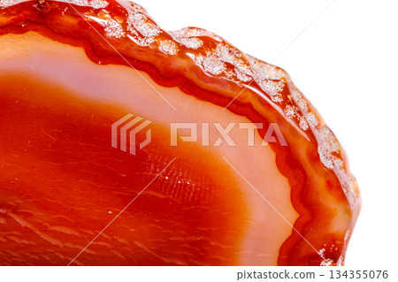 Macro mineral orange agate in crystals on white background Macro mineral orange agate in crystals on white background 134355076