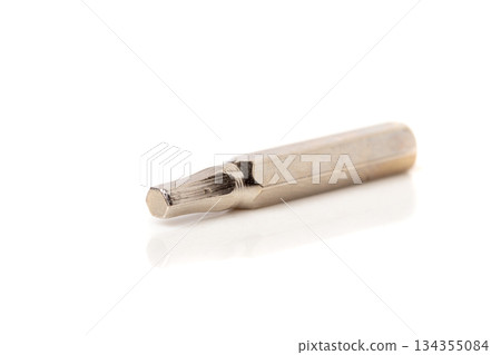A set of different attachments for a head screwdriver with a screwdriver on a white background A set of different attachments for a head screwdriver with a screwdriver on a white background 134355084