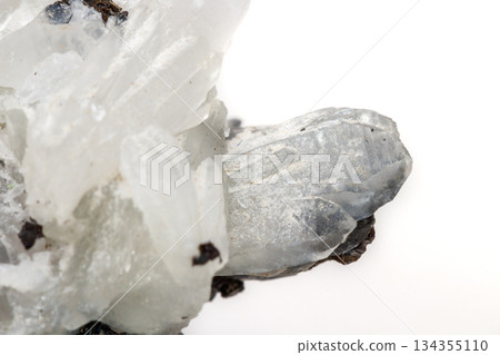 Macro mineral stone Drusus quartz with sphalerite in the rock a white background Macro mineral stone Drusus quartz with sphalerite in the rock a white background 134355110