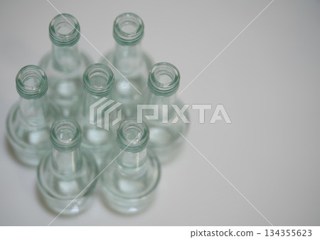 glass bottle arrangement, serene scene of glass bottles with subtle reflections for branding mockup glass bottle arrangement, serene scene of glass bottles with subtle reflections for branding mockup 134355623