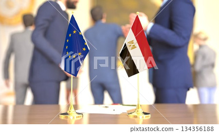 EU - Egypt partnership meeting with desk flags, 3D rendering 134356188