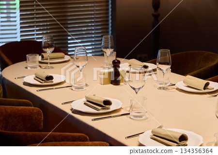sophisticated table arrangement prepared, refined place setting prepared for culinary tasting 134356364
