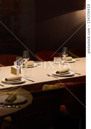 ambient lighting and beautifully arranged table create professional social gathering ambiance ambient lighting and beautifully arranged table create professional social gathering ambiance 134356419