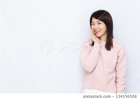Smiling woman whispering 134356508