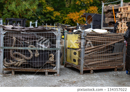 Various types of discarded materials stored in metal cages at a recycling Various types of discarded materials stored in metal cages at a recycling 134357022