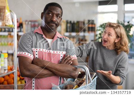 Family quarrel between husband and wife while shopping in grocery supermarket Family quarrel between husband and wife while shopping in grocery supermarket 134357719