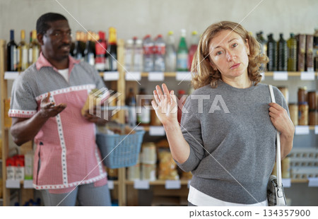 Family quarrel between husband and wife while shopping in grocery supermarket Family quarrel between husband and wife while shopping in grocery supermarket 134357900