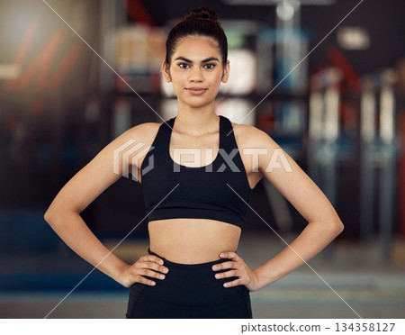 Fitness, motivation and healthy woman with wellness goal for workout, exercise and training in sports gym. Portrait of personal trainer, coach and power athlete with muscle building vision 134358127