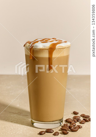 glass of caramel latte with coffee beans glass of caramel latte with coffee beans 134359806
