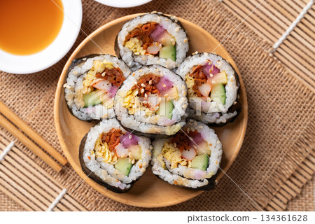 Kimbap, Korean food made from cooked rice with vegetables, egg and wrapped with dried seaweed Kimbap, Korean food made from cooked rice with vegetables, egg and wrapped with dried seaweed 134361628