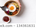 Bibimbap, Korean food, Cooked rice with vegetables, pork, egg and gochujang 134361631