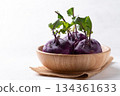 Purple kohlrabi or turnip cabbage in wooden bowl on white background 134361633