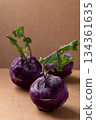 Purple kohlrabi or turnip cabbage on brown background 134361635