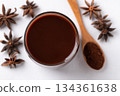 Hot chocolate in glass and star anise on white background, Top view 134361638