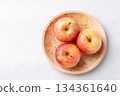 Red apple fruit (Gala apple) in natural plate on white background, Top view 134361640