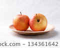 Red apple fruit (Gala apple) in natural plate on white background 134361642