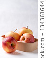 Red apple fruit (Gala apple) in natural bowl on white background 134361644