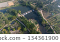 Aerial view of small spillway in Pa Daet district in Chiang Rai province of Thailand. Spillway, passage for surplus water over or around a dam when the reservoir itself is full. 134361900