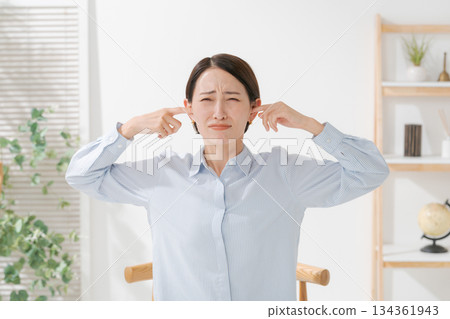 A woman clogging the ear A woman clogging the ear 134361943