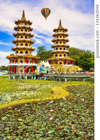 A balloon composite floating above Kaohsiung's Dragon and Tiger Pagodas 134362044