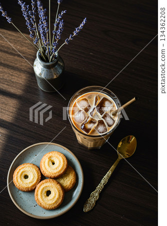 Iced Coffee and Butter Cookies with Lavender on Dark Wooden Table Iced Coffee and Butter Cookies with Lavender on Dark Wooden Table 134362208