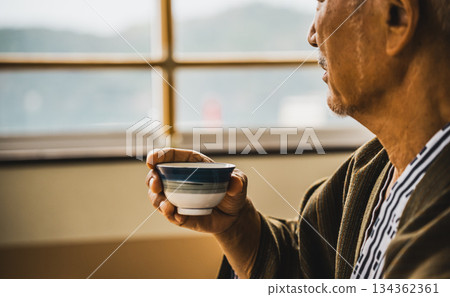 Senior man's tea drinking time Senior man's tea drinking time 134362361