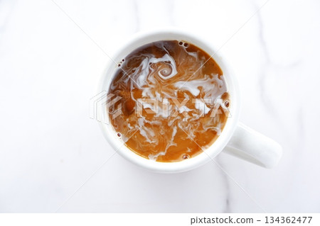 Coffee - A top view of a mug filled with freshly brewed coffee Coffee - A top view of a mug filled with freshly brewed coffee 134362477