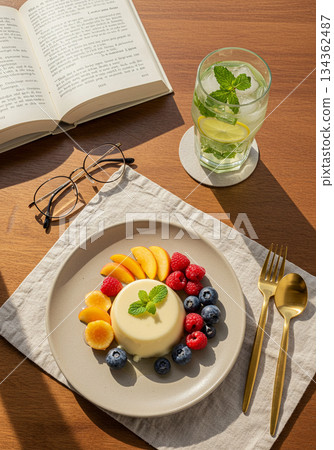 Panna Cotta with Fresh Fruit and Mint Lemon Drink on Wooden Table 134362487