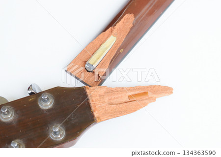 part of broken wood acoustic guitar isolated on white background 134363590