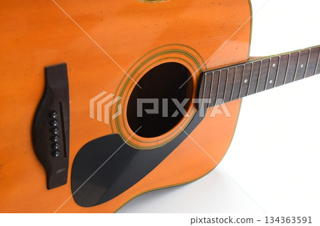 brown wood acoustic guitar isolated on white background 134363591