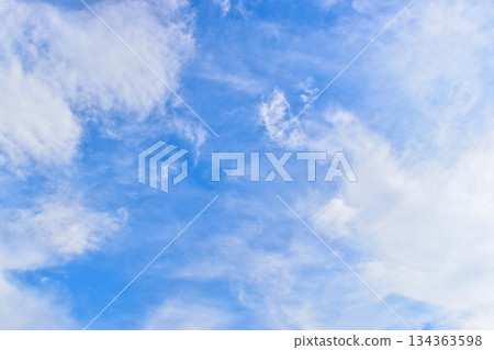beautiful blue sky and white fluffy group of clouds with sunrise in the morning, natural background 134363598