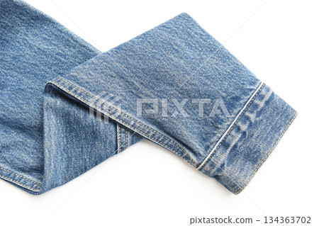 sleeve of blue denim shirt texture isolated on white background, jean fashion style 134363702