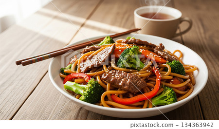 Sesame Beef Stir Fry Noodles with Hot Tea 134363942