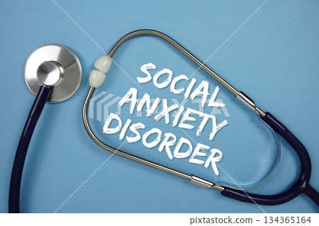Social Anxiety Disorders text with Stethoscope on blue background Social Anxiety Disorders text with Stethoscope on blue background 134365164