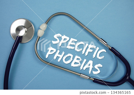 Specific Phobias text with Stethoscope on blue background Specific Phobias text with Stethoscope on blue background 134365165