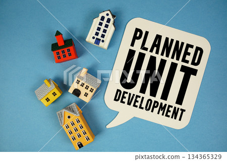 PUD Planned Unit Development text with house models on blue background PUD Planned Unit Development text with house models on blue background 134365329