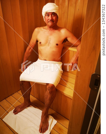 Man in a private sauna Man in a private sauna 134367322