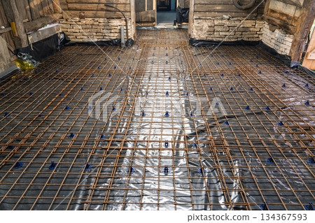 Reinforced Concrete Slab Preparation with Rebar Grid for Durable Construction Project Reinforced Concrete Slab Preparation with Rebar Grid for Durable Construction Project 134367593