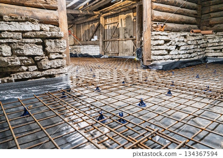 Reinforcement Grid Preparation for Concrete Pouring in Old House Renovation Project 134367594