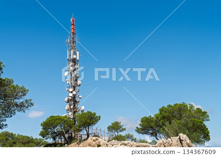 Telecommunications Tower on a Sunny Day, Symbolizing Modern Communication and Connectivity. Telecommunications Tower on a Sunny Day, Symbolizing Modern Communication and Connectivity. 134367609