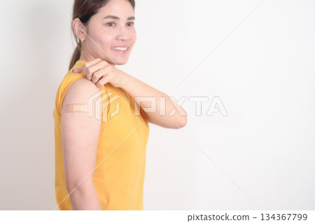 Adult Woman with bandage after received vaccine. Vaccination and Immunization for Influenza, HPV, Zoster, IPD, DTP or Diphtheria, Tetanus and Pertussis, MMR, Hepatitis B, Covid and Varicella vaccine Adult Woman with bandage after received vaccine. Vaccination and Immunization for Influenza, HPV, Zoster, IPD, DTP or Diphtheria, Tetanus and Pertussis, MMR, Hepatitis B, Covid and Varicella vaccine 134367799