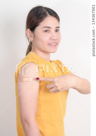 Adult Woman with bandage after received vaccine. Vaccination and Immunization for Influenza, HPV, Zoster, IPD, DTP or Diphtheria, Tetanus and Pertussis, MMR, Hepatitis B, Covid and Varicella vaccine Adult Woman with bandage after received vaccine. Vaccination and Immunization for Influenza, HPV, Zoster, IPD, DTP or Diphtheria, Tetanus and Pertussis, MMR, Hepatitis B, Covid and Varicella vaccine 134367801